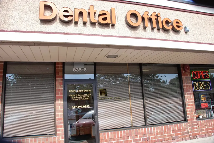 The North Shore Dental storefront at 635 Chicago Avenue, Suite 6, under a Dental Office sign.